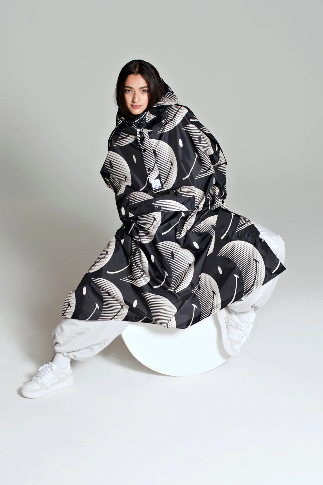 Rain Kiss Half Moon Smiley Rain Poncho In Black and Sand - Image 2
